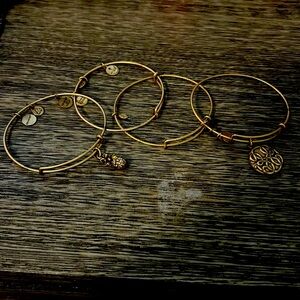 Alex and Ani copper bracelets. Four bracelets. Two have no large charms.